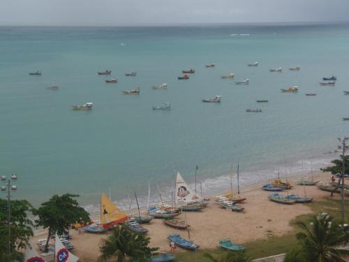 an aerial view of a beach with boats in the water at Apartment Neo 2.0 in Maceió