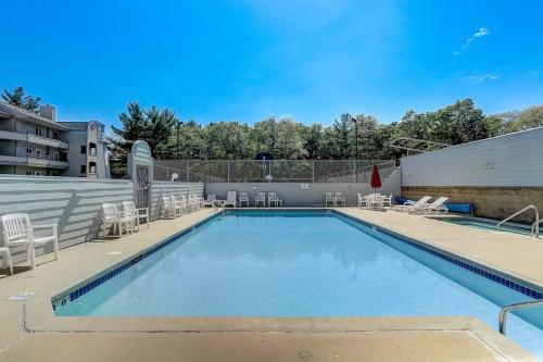 a large swimming pool with chairs at WFC II Lake Access - Family or Romance - Location! in Wisconsin Dells