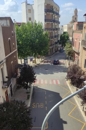 an empty street in a city with a car on it at Appartamenti Boho Chic in Sannicandro di Bari