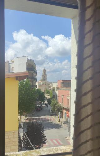 a view of a city street from a window at Appartamenti Boho Chic in Sannicandro di Bari