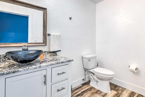 a bathroom with a sink and a toilet at Lakefront Wichita Falls Home with Pool and Hot Tub in Wichita Falls