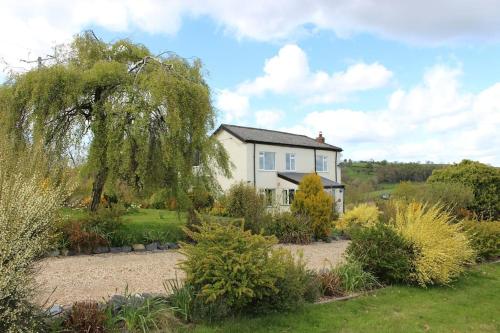 a house in the middle of a garden at Country Home with Gardens in Newtown