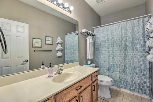 a bathroom with a sink and a toilet and a shower at Goodyear Desert Oasis with Patio and Game Room! in Goodyear