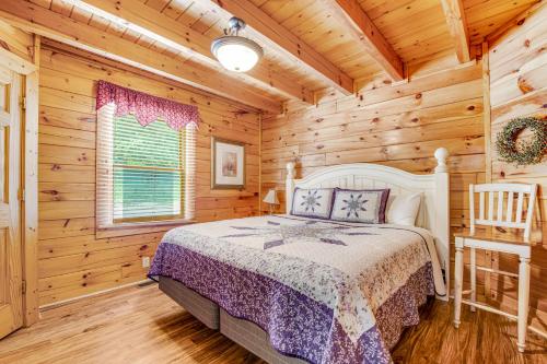 a bedroom with a bed in a log cabin at Almost Heaven in Pigeon Forge