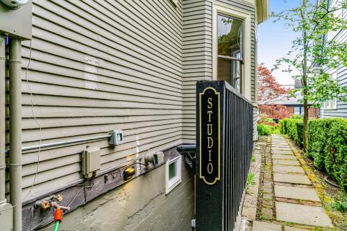 a house with a sign on the side of it at The Studio in Seattle