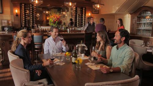 a group of people sitting around a table in a restaurant at Ledson Hotel & Zina Lounge in Sonoma