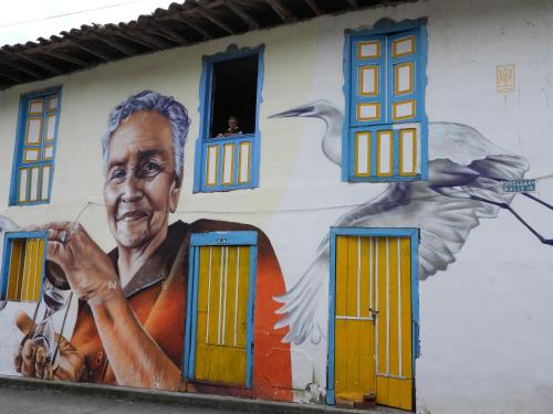 a mural of a man on the side of a building at Finca TRADICIONAL EL OTOÑO in Pijao