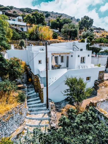 a white house on a hill with stairs at Agapi Home in Agápi