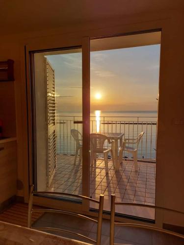 a view of the ocean from the balcony of a house at Attico fronte mare in Martinsicuro