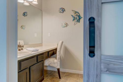 a bathroom with a sink and a mirror at Getaway to iki Tampa is an End Unit Townhome - Close to Tampa Bay & Downtown - Minutes to Airport in Tampa