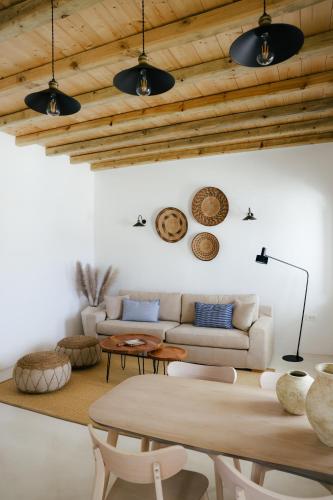 a living room with a couch and a table at Agapi Home in Agápi