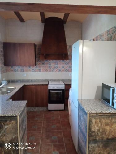A kitchen or kitchenette at Casa rural PERALTA S CAZORLA PISCINA COMPARTIDA