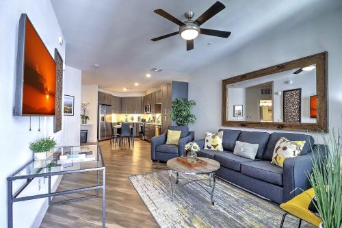 a living room with a blue couch and a ceiling fan at High End, Serene Stay with Parking Included G3047 in Scottsdale