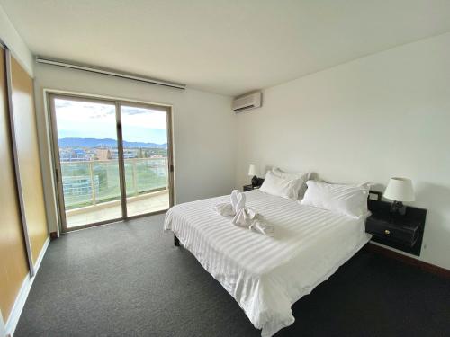 Ένα ή περισσότερα κρεβάτια σε δωμάτιο στο Casa Del Sole Apartments
