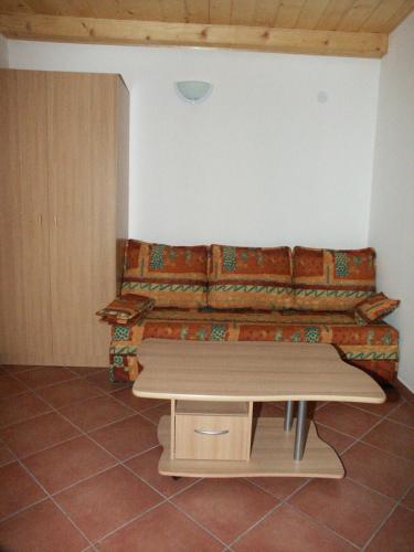 a living room with a couch and a table at Apartments by the sea Pomena, Mljet - 614 in Pomena