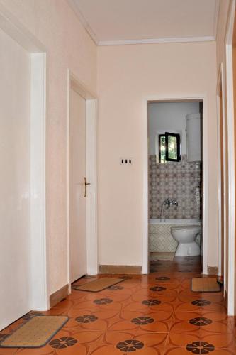 an empty bathroom with a toilet and a sink at Apartments by the sea Prozurska Luka, Mljet - 619 in Prožura