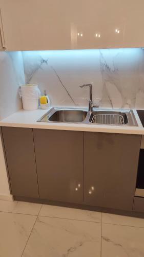 a kitchen with a sink and a counter at Apartments Barbie in Rethymno Town