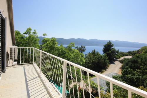 a balcony with a view of the water at Apartments by the sea Viganj, Peljesac - 633 in Viganj