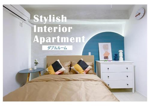 a bedroom with a bed with a sign that readskrit informant apartment at nestay apartment tokyo ginza in Tokyo