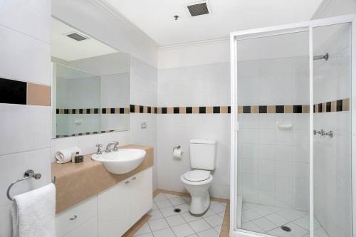 a bathroom with a toilet and a glass shower at ALF49-Huge 2BR Penthouse Style, Great Water Views in Sydney