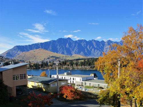 a view of a town with a lake and mountains at Spectacular Lake & Mountain Views in Queenstown