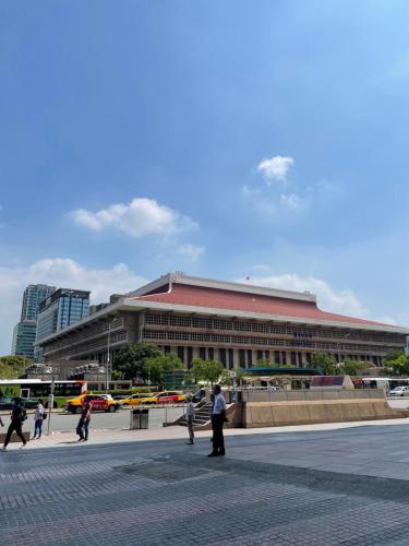 a large building with people walking in front of it at Water meworld in Taipei