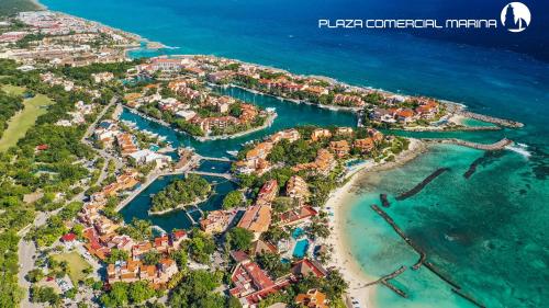 an aerial view of a resort on the beach at Beautiful apartment, prime location, beach 2 minutes away in Puerto Aventuras