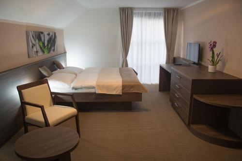 Posteľ alebo postele v izbe v ubytovaní Restaurace a Penzion U Klásků