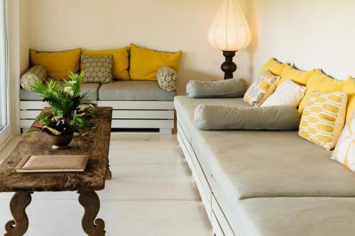 a living room with a couch and a table at Rukgala Retreat in Digana