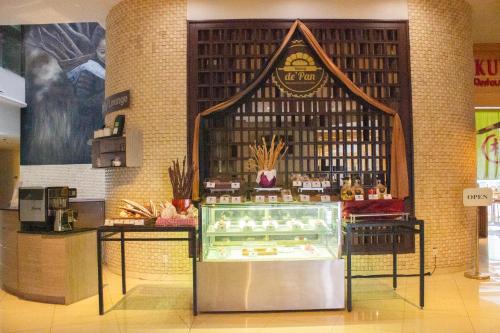 a bakery with a display case in a store at Sakura Park Hotel & Residence in Cikarang