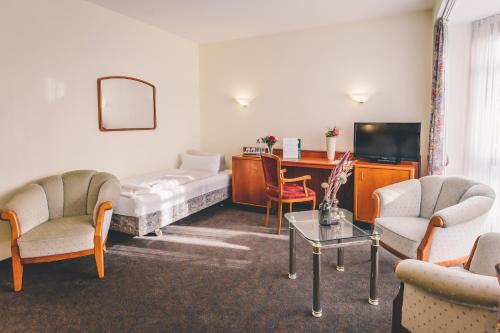 TV a/nebo společenská místnost v ubytování Hotel Gasthaus Appel Krug