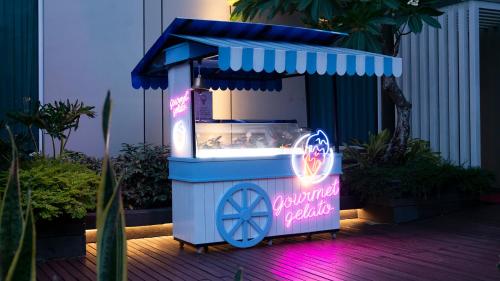 a ice cream machine with a sign that says pineapple delight at Radisson Lampung Kedaton in Bandar Lampung