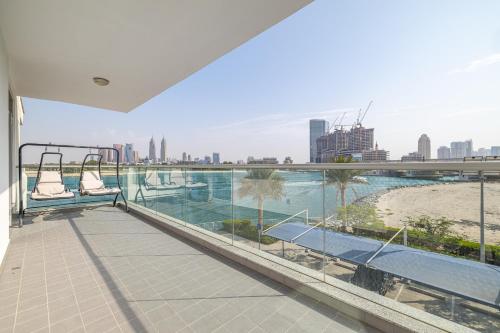 a balcony with chairs and a view of the city at 2BDR apartment with full sea view and Dubai Marina view Azure Residences in Dubai