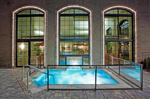 a swimming pool in front of a building at Holiday Inn Midland, an IHG Hotel in Midland