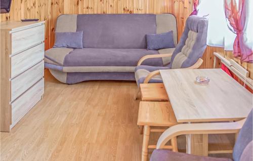 a living room with a couch and a table at Awesome Home In Jaroslawiec With 1 Bedrooms in Jarosławiec