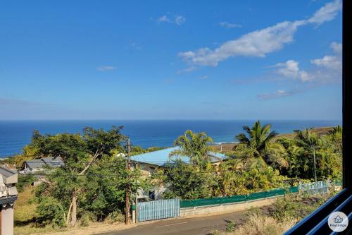 a view of the ocean from a house at Kaz Bois Blanc, classée 3 étoiles - Vue mer - Les Avirons in Les Avirons