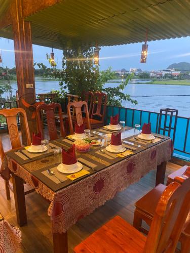 a wooden table with hats on top of it at Tam Coc Wonderland Bungalow in Ninh Binh