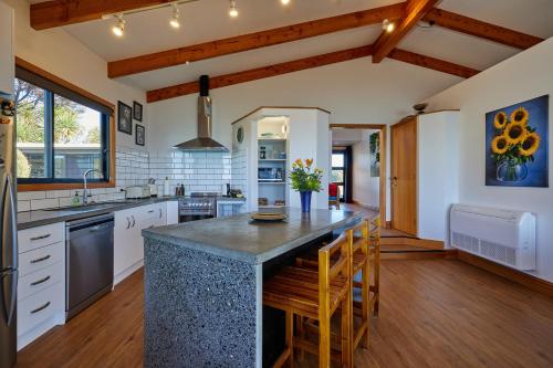 a kitchen with a large island with a counter top at A Room With a View in Kaikoura