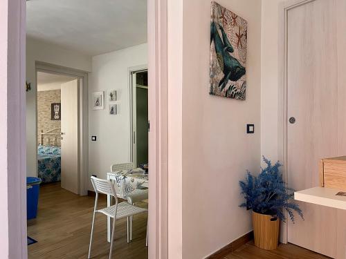 a living room with a table and chairs at Domus Caricatore in Sciacca