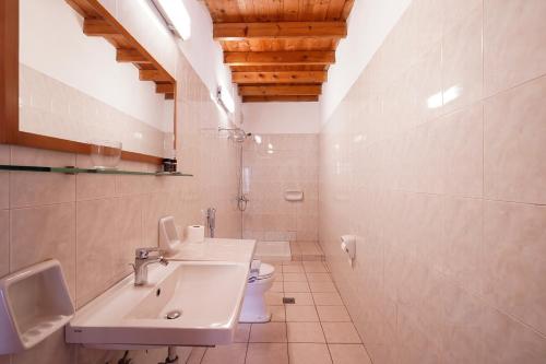 a bathroom with a sink and a toilet at XENIA HOTEL in Sfakia