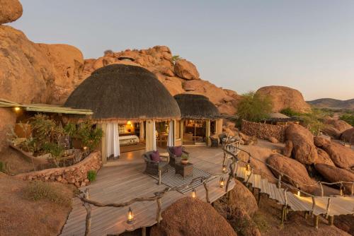 an aerial view of a resort with rocks at Camp Kipwe in Twyfelfontein