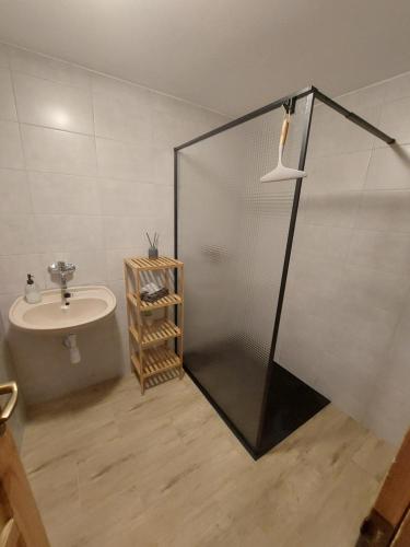 a bathroom with a shower and a sink at Chaty Javorina in Javorina