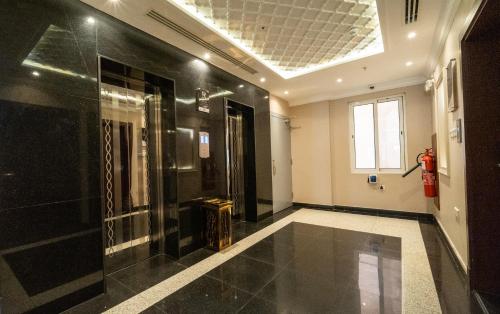 a hallway with a room with a fire hydrant at Luxury Hospitality Serviced Apartments in Al Khobar