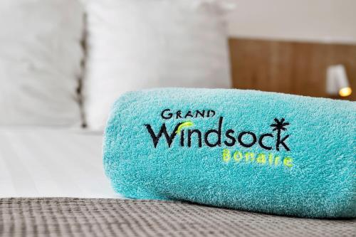 a blue pillow with the words grand windsockonne on it at Grand Windsock Bonaire in Kralendijk