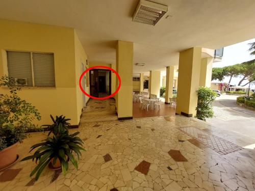 a red circle is on the side of a building at BIBAHOME in Cogoleto