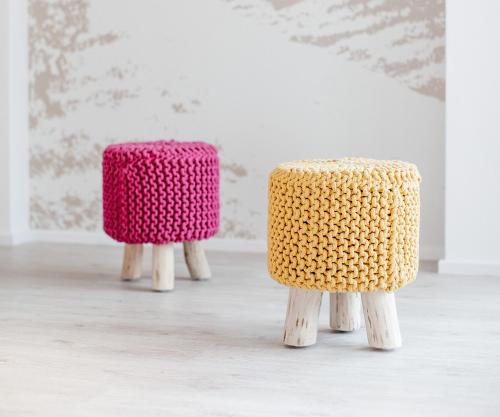 two knittedools sitting on wooden stools in a room at Pflugwirts Hotel und Gasthaus in Oberkirch