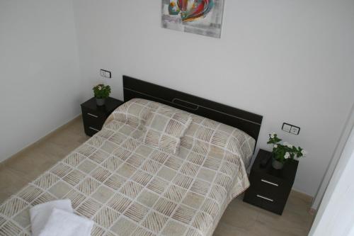 A bed or beds in a room at Apartament Franmar