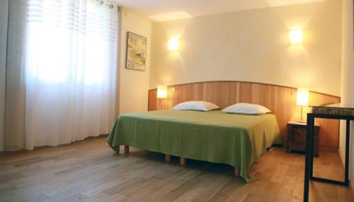 Postel nebo postele na pokoji v ubytování Mas de L'Ermitage
