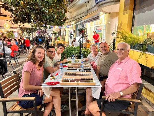 a group of people sitting at a table at Stephen Center B&B in Tirana