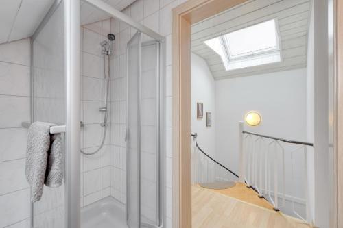 a bathroom with a shower with a glass door at Ferienhaus Vera in Kirchheim